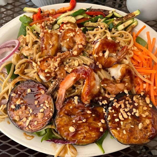 Cape Fear Café's shrimp and noodle dish with grilled vegetables, eggplant, and peanuts.